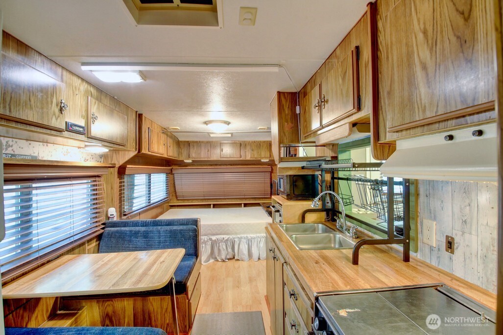 3-2 Wilderness Way Maple Falls, WA 98266 - Photo 14 of 39 a kitchen with stainless steel appliances granite countertop a sink and a stove