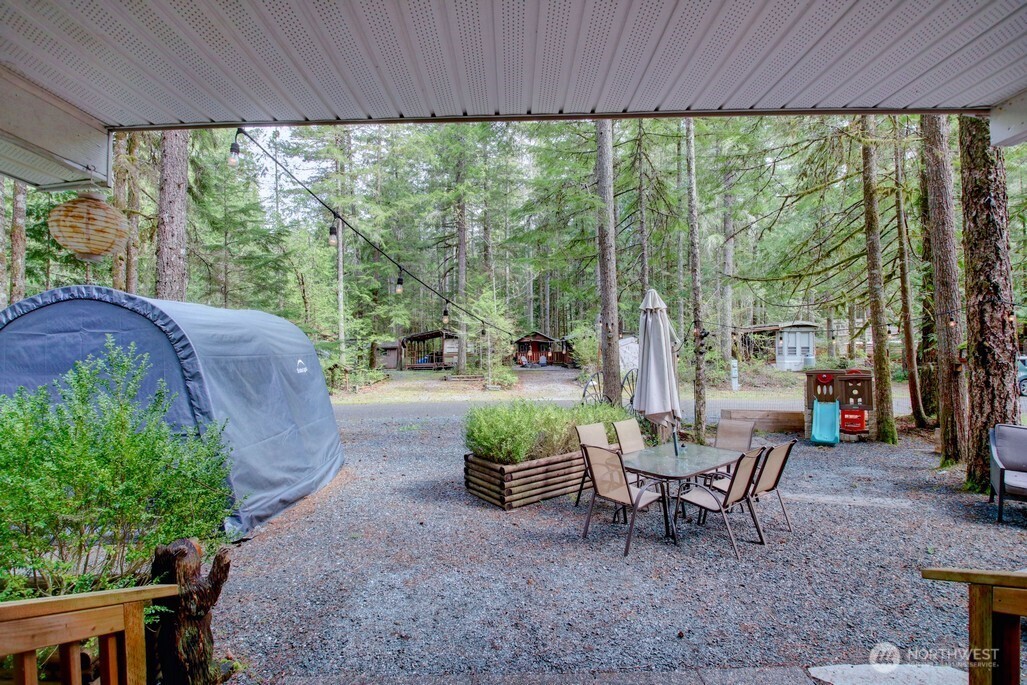 3-2 Wilderness Way Maple Falls, WA 98266 - Photo 19 of 39 a view of a patio with a table chairs and a backyard