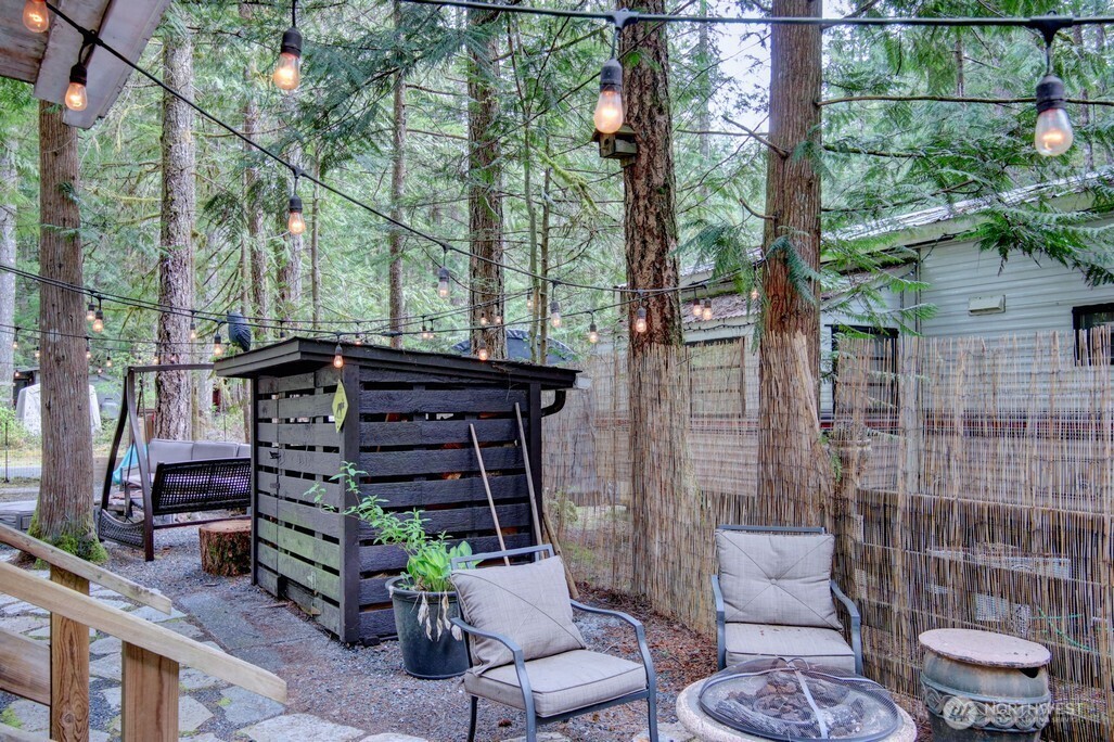 3-2 Wilderness Way Maple Falls, WA 98266 - Photo 20 of 39 a view of a chairs and table in backyard