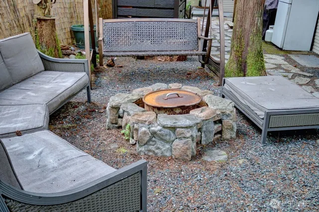 an aerial view of a backyard with table and chairs