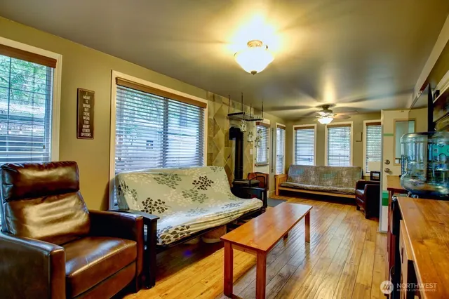 a living room with furniture and a chandelier