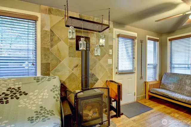 a living room with a couch and a potted plant