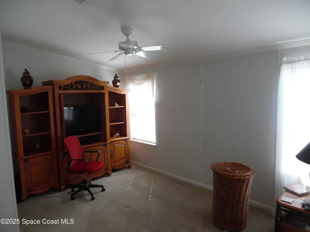 a bedroom with a bed and a chair