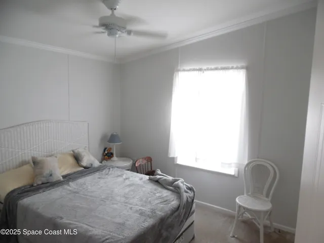 a white toilet sitting next to a bath tub