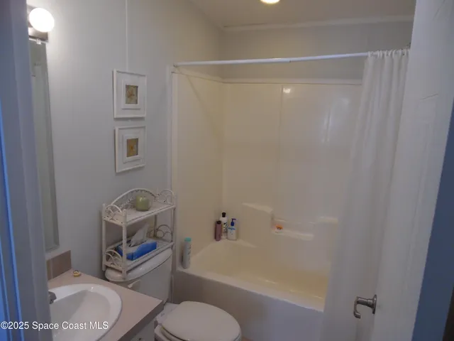 a kitchen with a sink and a stove top oven