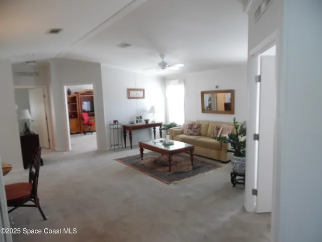 a bedroom with a bed and a lamp