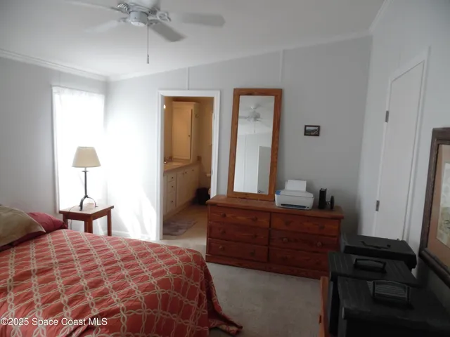 a hallway with a bed and a couch