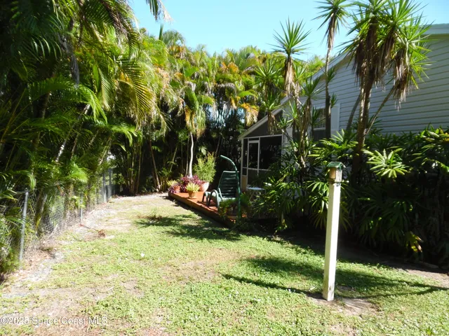 a view of a chair and tables in the patio