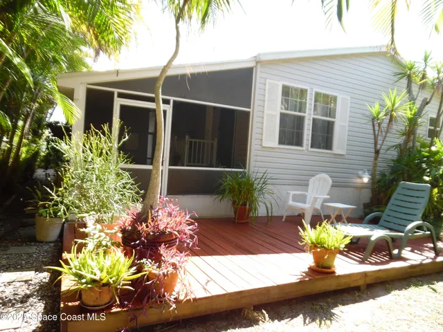 a view of backyard of a house with green space