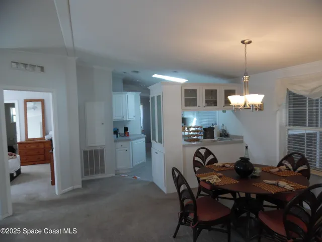 a living room with furniture and a chair