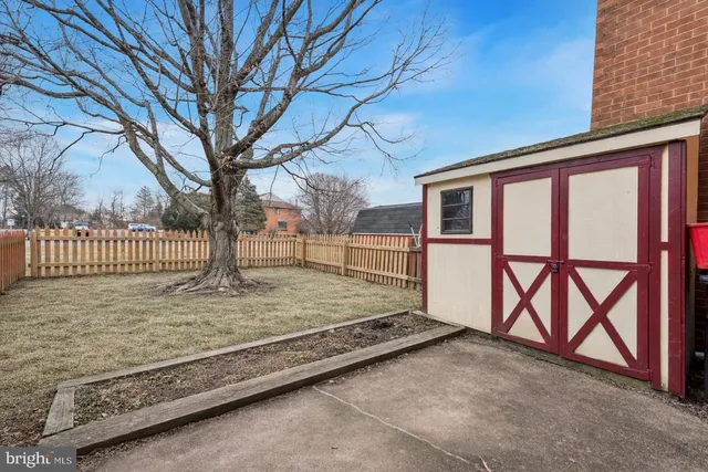 a view of backyard with a small cabin