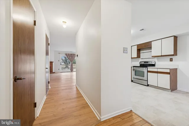 a view of a kitchen from the hallway