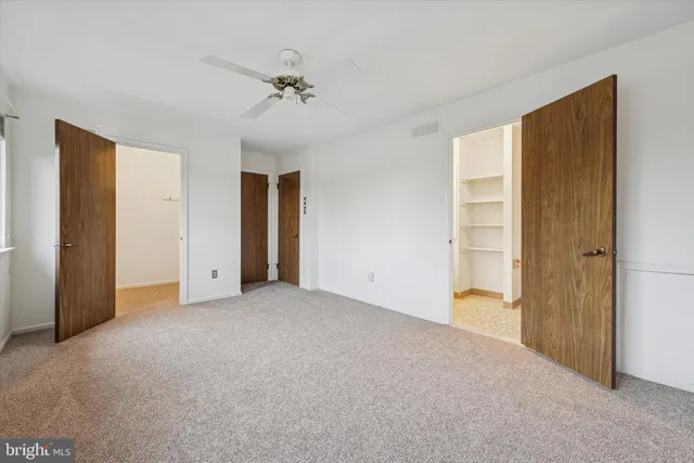 a view of an empty room with a bathroom