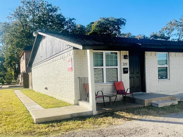 a backyard of a house with seating space