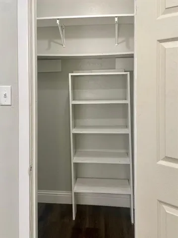 a view of an empty walk in closet