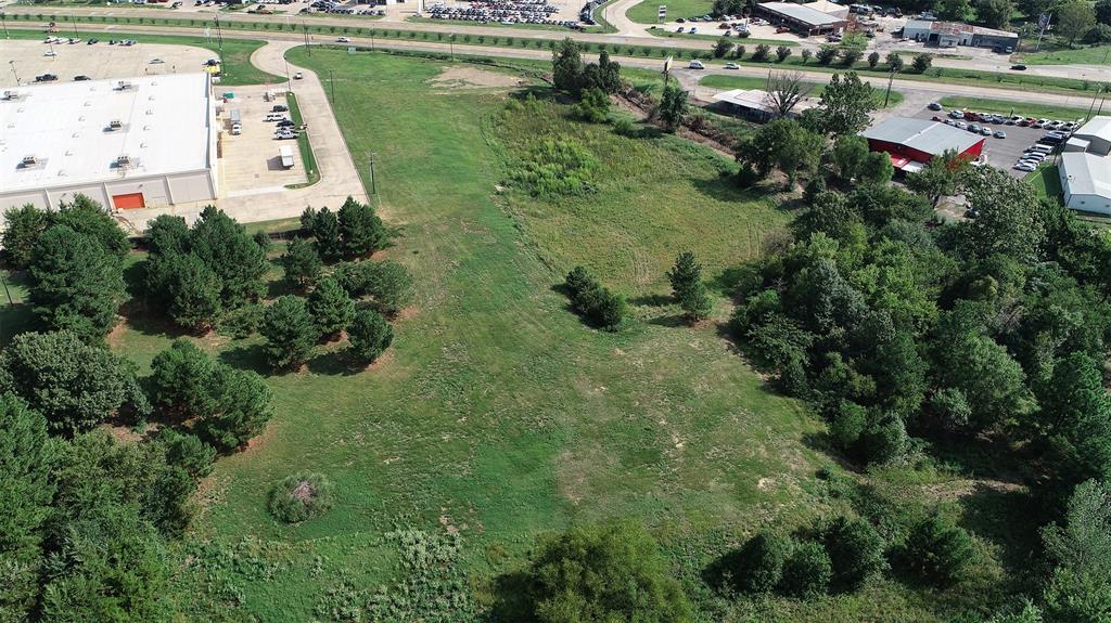 3200 Northeast Loop 286 Paris, TX 75460 - Photo 14 of 28 an aerial view of a house with outdoor space and lake view
