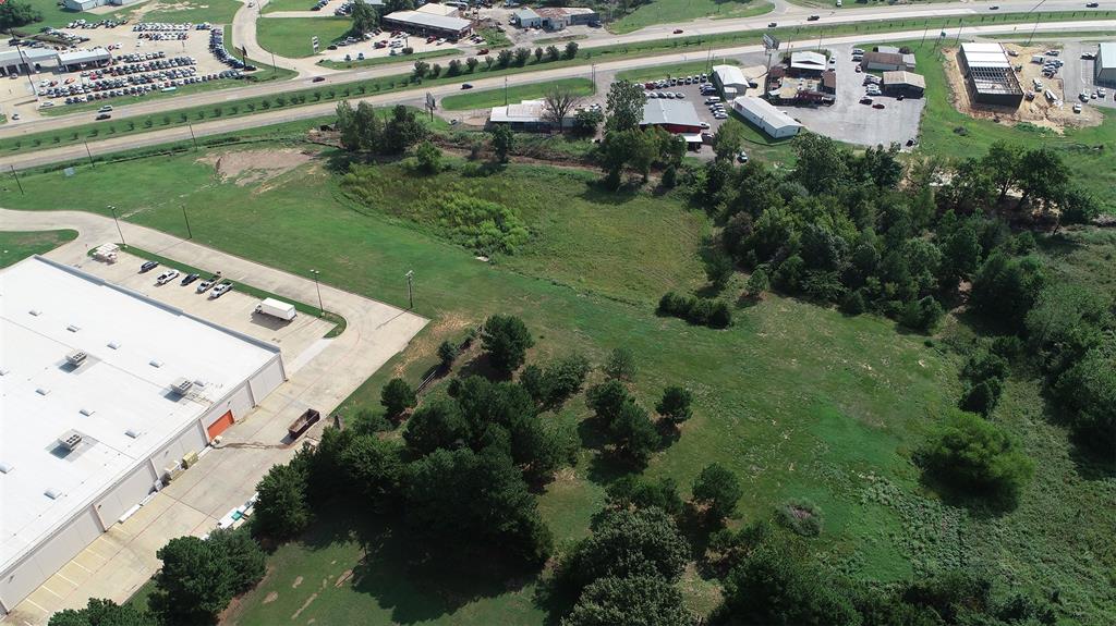 3200 Northeast Loop 286 Paris, TX 75460 - Photo 16 of 28 an aerial view of a residential houses with outdoor space and street view