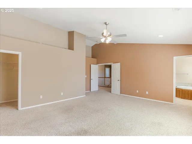 a view of empty room with a bathroom