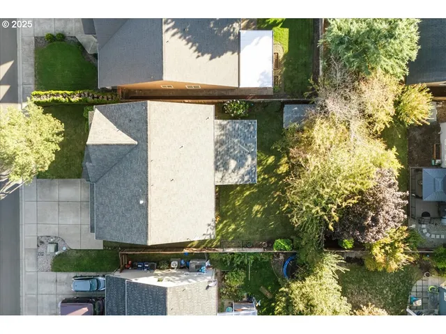 a view of backyard with wooden wall