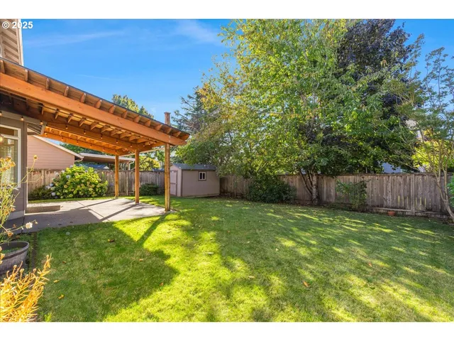 a view of a backyard with a small cabin