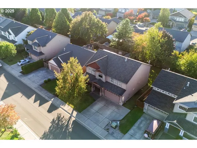 an aerial view of a house with a garden