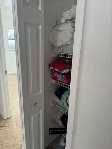 a bedroom with a bed and a sink