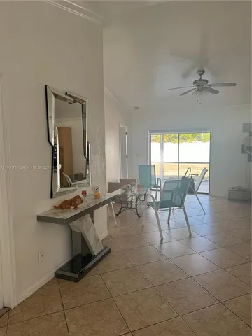 a view of a livingroom with furniture and a table