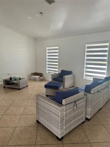 a bedroom with furniture and window