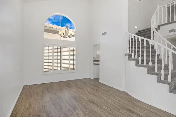 a view of an entryway with wooden floor