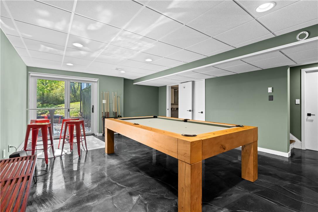 1506 Pleasant View Road Coopersburg, PA 18036 - Photo 69 of 97 A vibrant game room offers sleek flooring and direct access to outdoor serenity.
