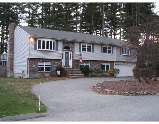 22 Albion Road Billerica, MA 01821 - Photo 1 of 26 a house that has a tree in front of it
