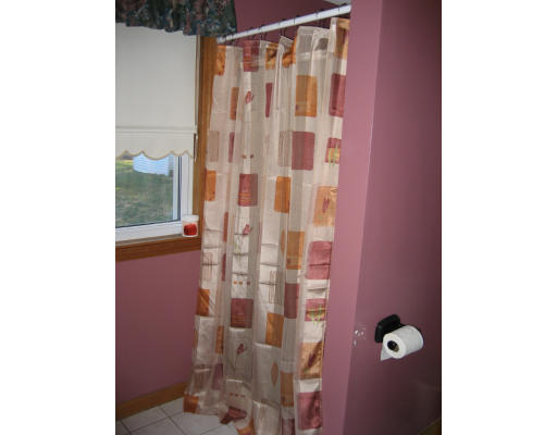 22 Albion Road Billerica, MA 01821 - Photo 14 of 26 a bathroom with a shower and a toilet