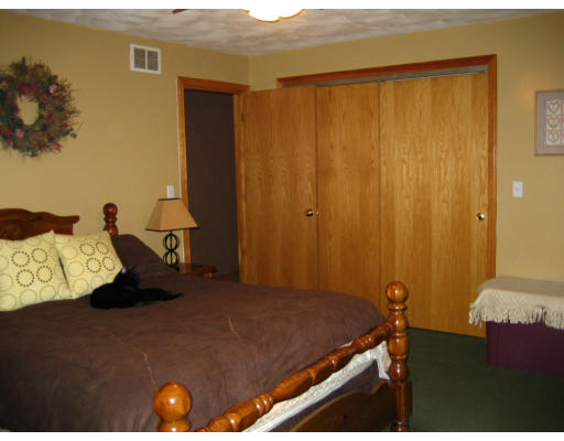 22 Albion Road Billerica, MA 01821 - Photo 20 of 26 a bedroom with a bed and a dresser