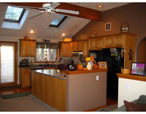 22 Albion Road Billerica, MA 01821 - Photo 2 of 26 a kitchen with stainless steel appliances granite countertop a refrigerator a sink and a stove