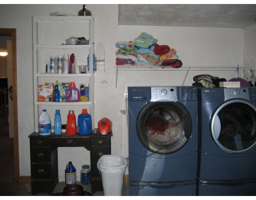 22 Albion Road Billerica, MA 01821 - Photo 24 of 26 a room with lots of clutter and hanging wooden floor