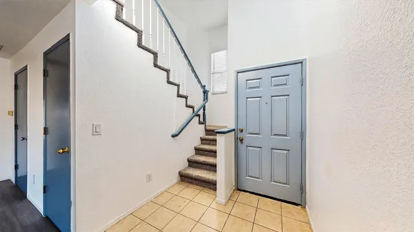 a view of entryway with stairs and wooden floor