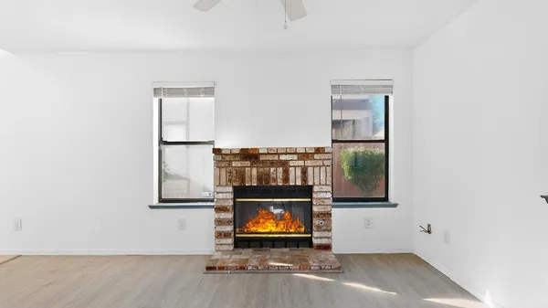 a view of an entryway with wooden floor