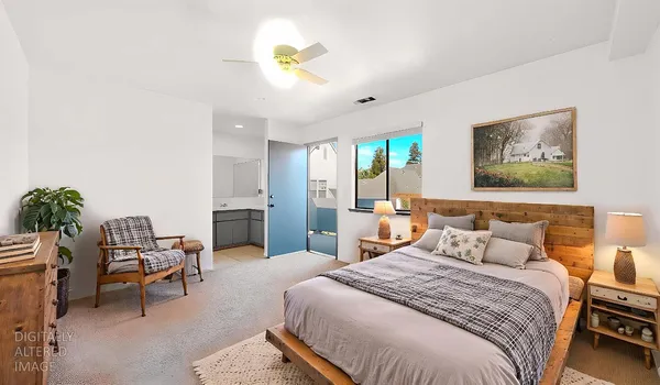 a bedroom with a bed and a couch