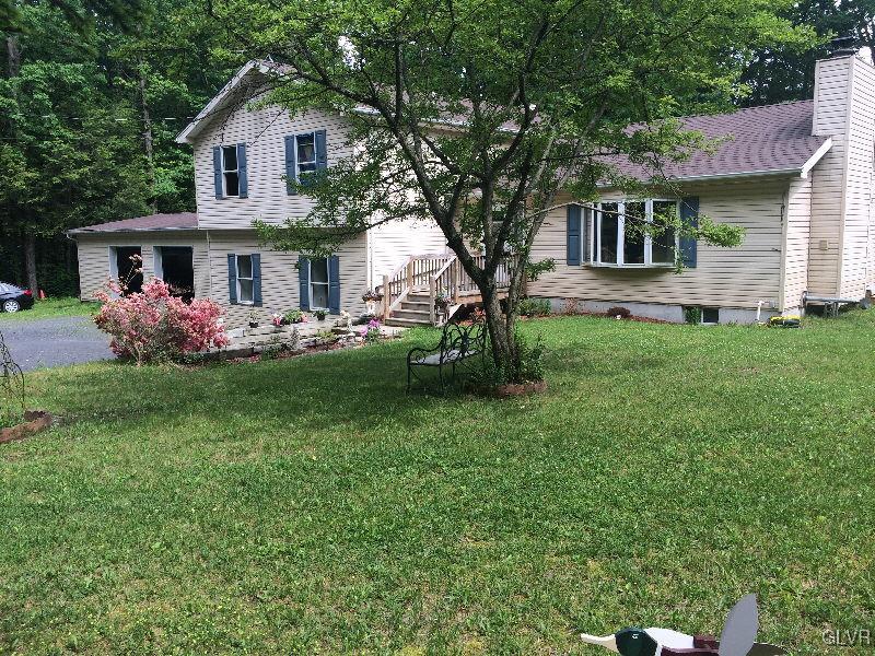 1412 Kroucher Road Stroudsburg, PA 18360 - Photo 1 of 40 a front view of house with yard and green space
