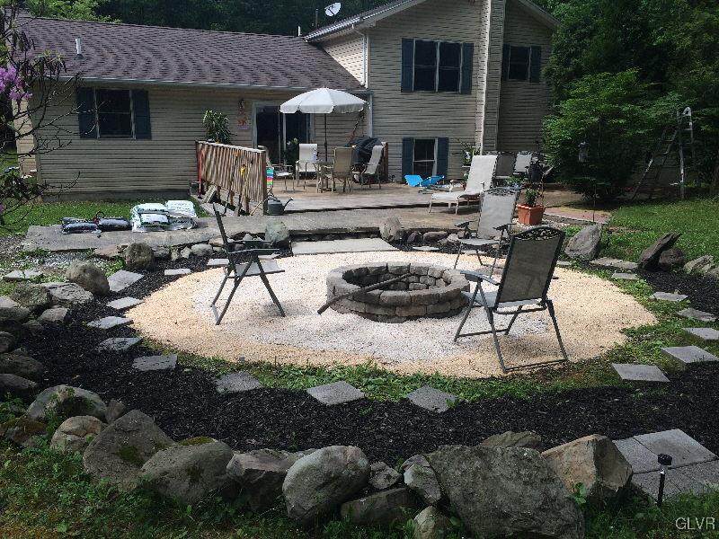 1412 Kroucher Road Stroudsburg, PA 18360 - Photo 11 of 40 a view of a house with backyard and sitting area