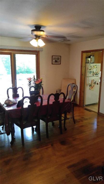 1412 Kroucher Road Stroudsburg, PA 18360 - Photo 21 of 40 a view of a dining room with furniture and wooden floor