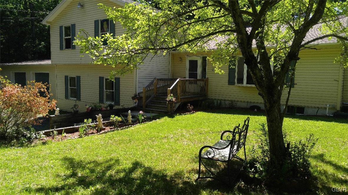 1412 Kroucher Road Stroudsburg, PA 18360 - Photo 3 of 40 a front view of a house with garden