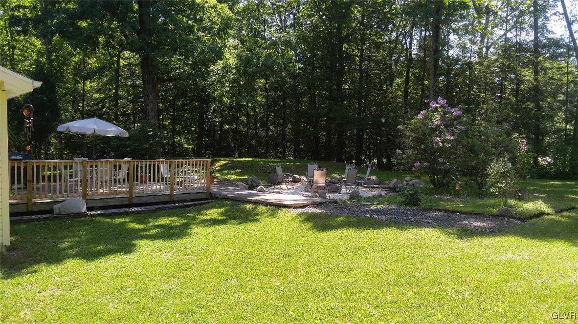 1412 Kroucher Road Stroudsburg, PA 18360 - Photo 7 of 40 a view of a swimming pool with a garden