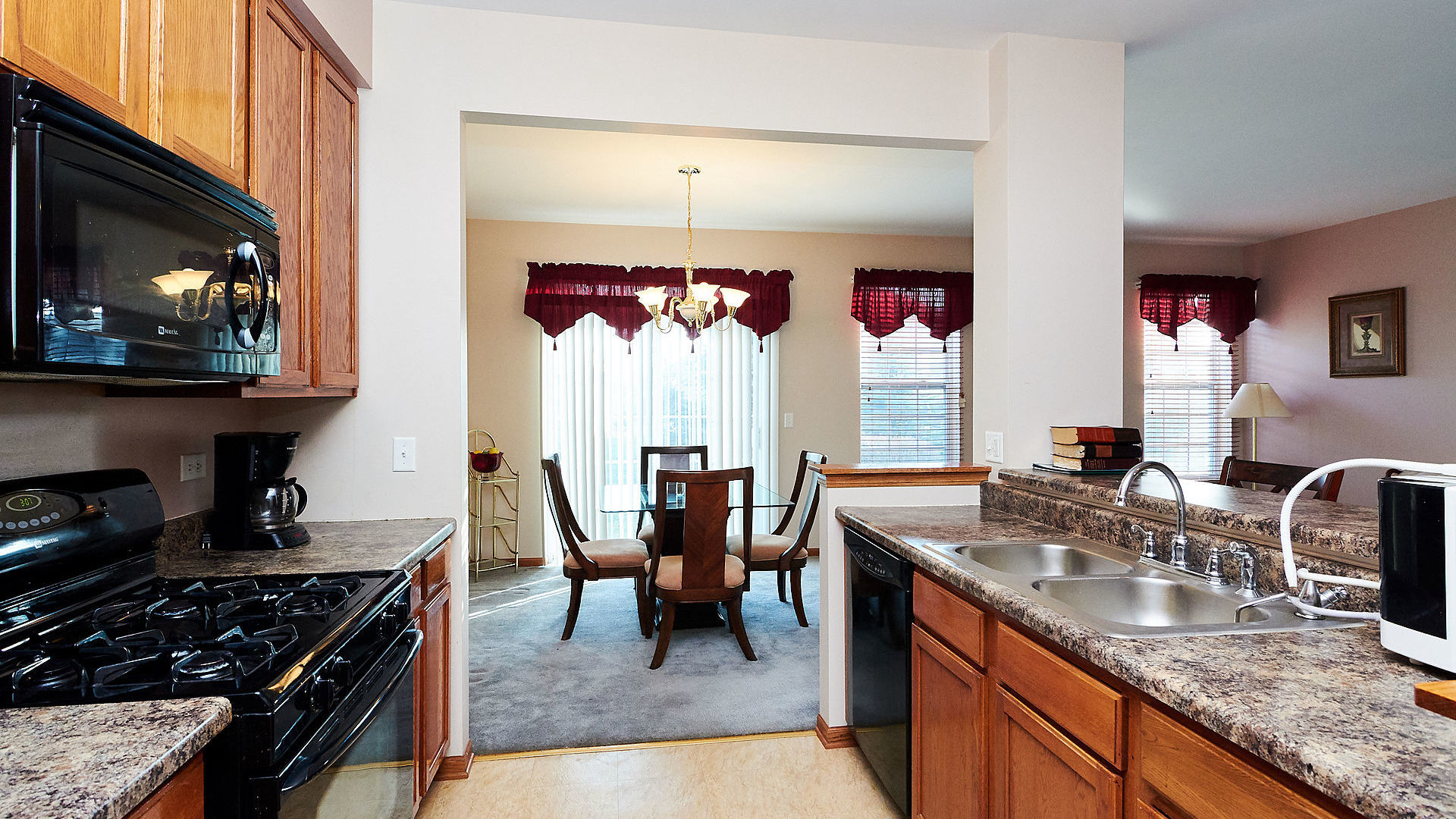 1989 West Cobblestone Road, Unit 1989 Romeoville, IL 60446 - Photo 16 of 51 a kitchen with granite countertop lots of counter top space