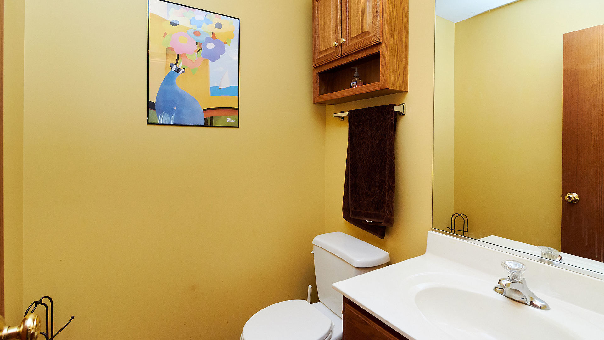 1989 West Cobblestone Road, Unit 1989 Romeoville, IL 60446 - Photo 18 of 51 a bathroom with a sink and a mirror