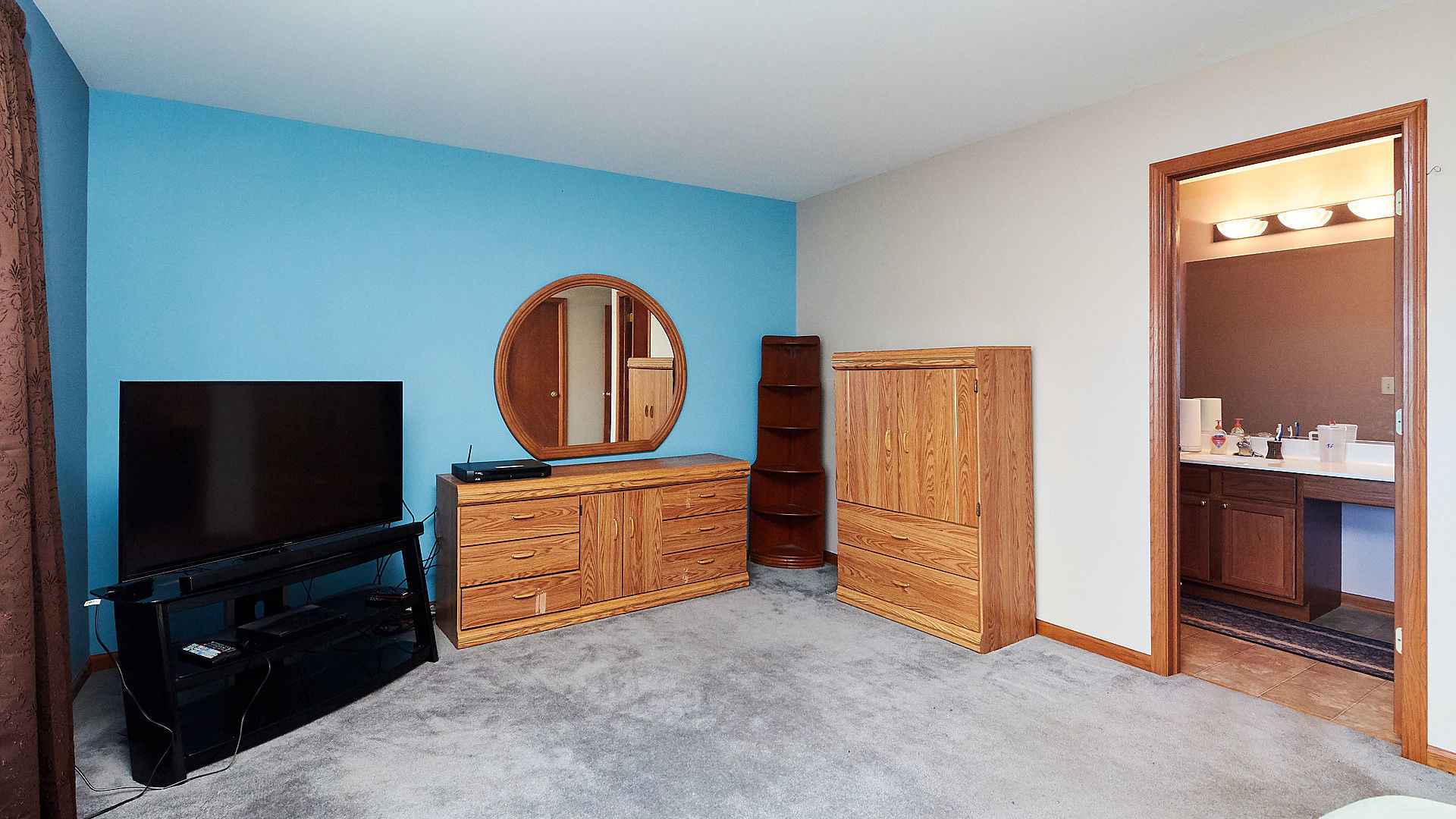 1989 West Cobblestone Road, Unit 1989 Romeoville, IL 60446 - Photo 28 of 51 a living room with furniture and a flat screen tv