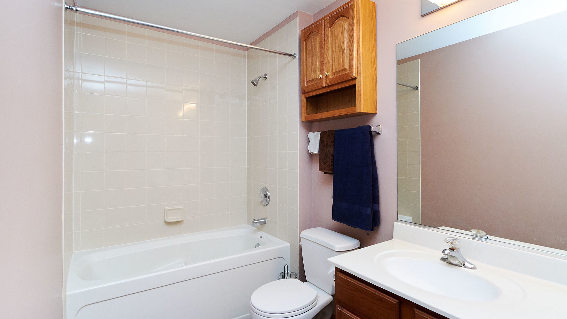 1989 West Cobblestone Road, Unit 1989 Romeoville, IL 60446 - Photo 29 of 51 a bathroom with a sink toilet and shower