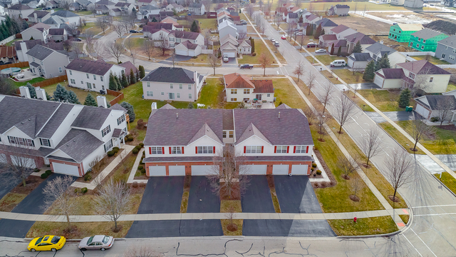 1989 West Cobblestone Road, Unit 1989 Romeoville, IL 60446 - Photo 40 of 51 an aerial view of residential houses with outdoor space