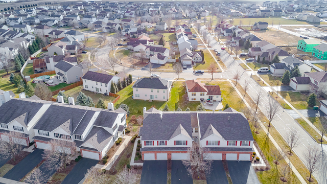 1989 West Cobblestone Road, Unit 1989 Romeoville, IL 60446 - Photo 46 of 51 an aerial view of residential houses with outdoor space