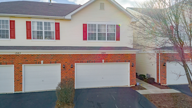 1989 West Cobblestone Road, Unit 1989 Romeoville, IL 60446 - Photo 51 of 51 a front view of a house with a garage